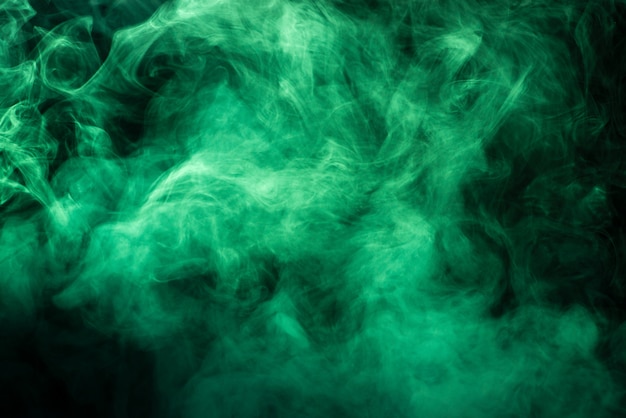 Photo saturated green smoke texture on black