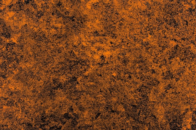 Saturated orange color heavy grunge texture surface for background