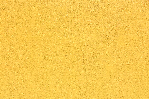 Foto sfondio in cemento a basso contrasto di colore giallo saturo