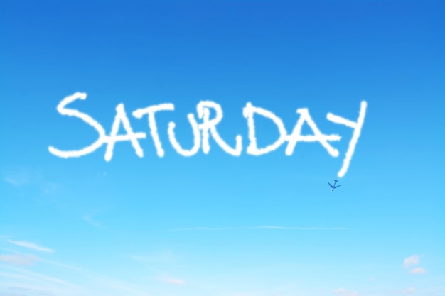 Saturday written in the sky with contrails