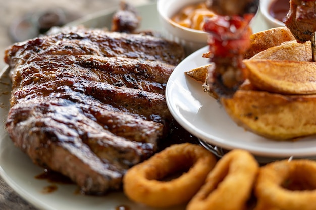 Sauce-baked ribs with potatoes and donuts