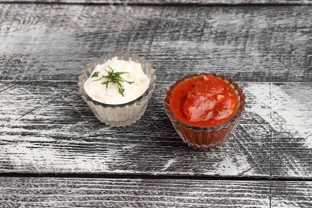 Sauce two sauces on a wooden white background