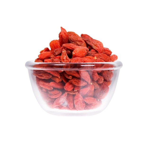 Saucepan with dried goji on white background