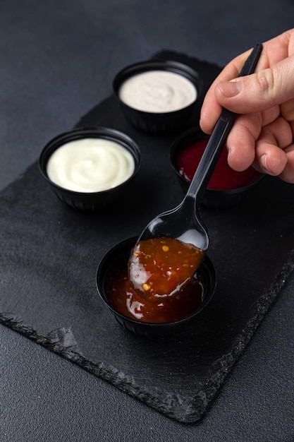 Photo sauces of asian cuisine on a black background