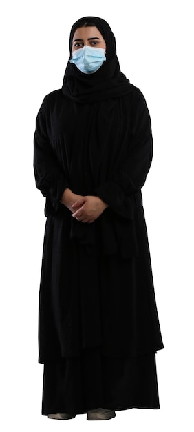 Photo saudi arab woman in abaya wearing a face mask standing facing