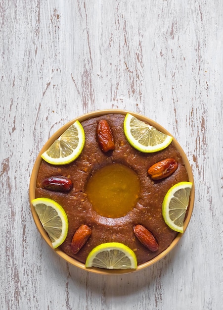 Saudi Arabia traditional dish Hineni, it is a mixed of dates and whole wheat. Ramadan food.