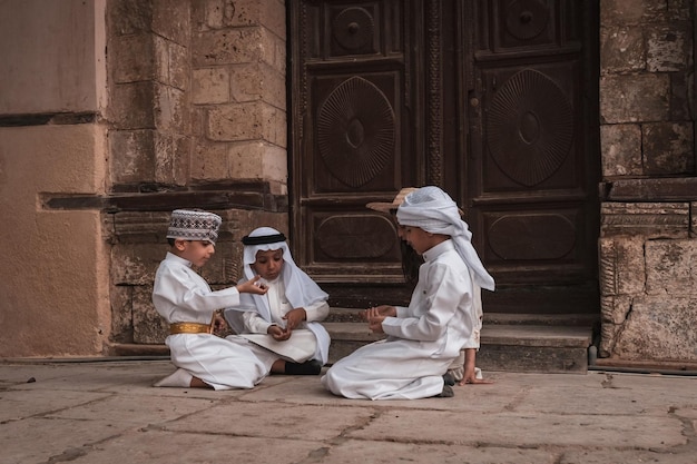 Saudi Arabian kids playing outside the house in Jeddah old town Saudi Srabia