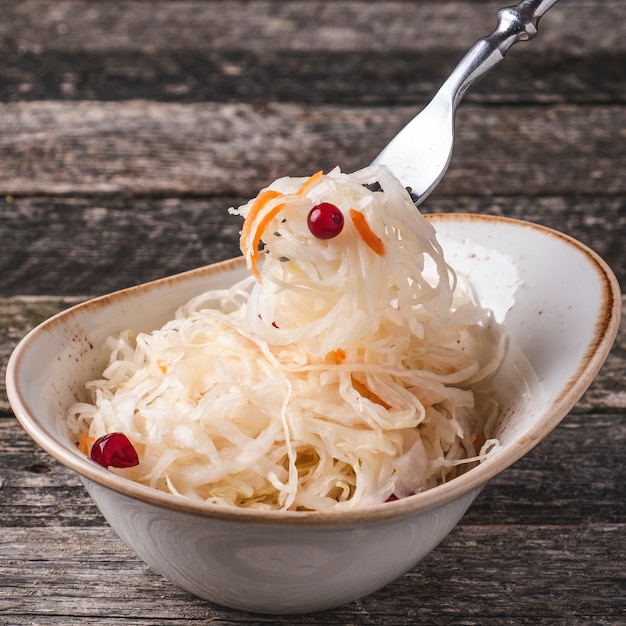 Sauerkraut  berries and onion in a bowl. Closeup