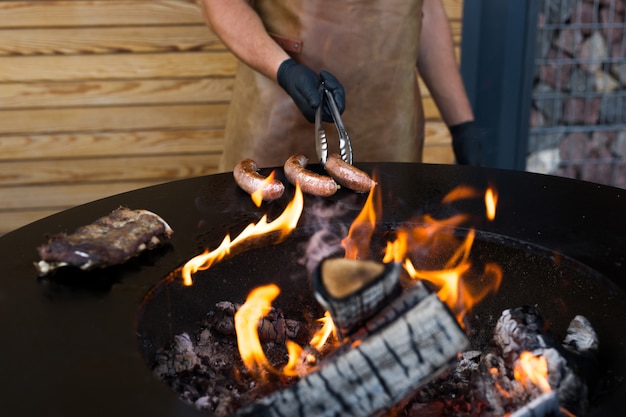 Sausage on Barbeque Smoker Grill. Hot and smoked sausage. Food Festival