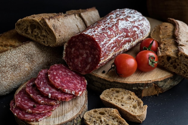 Sausage and bread on wooden table