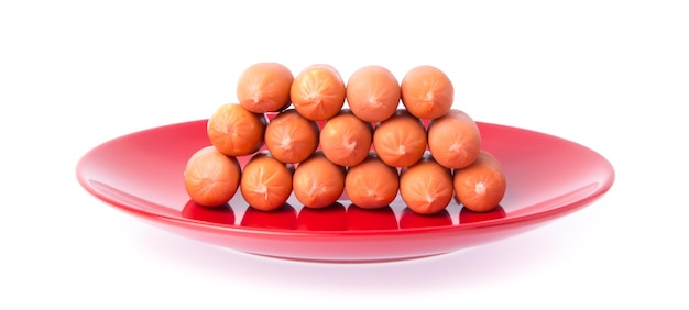 Sausage, cheese, breakfast on red dish isolated on a white background