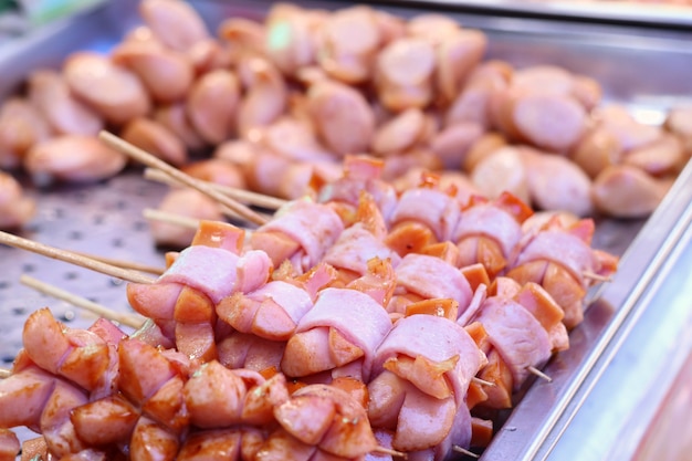 Sausage fried with bacon