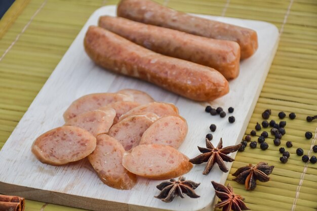 Sausage Or Guan Chiang and Herbs on the board serving good beer snacks