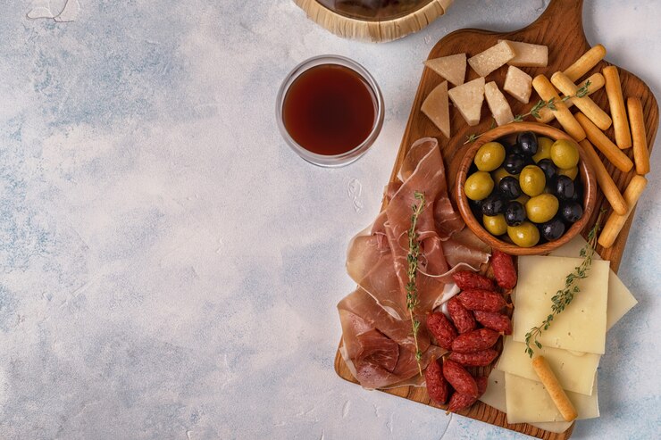 Sausage olives prosciutto cheese bread sticks.