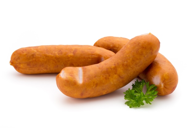 Sausage and spices isolated on white, fresh delicious frankfurter.