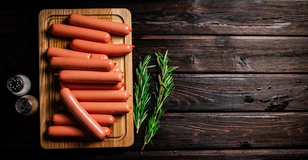 Sausages are delicious on a cutting board