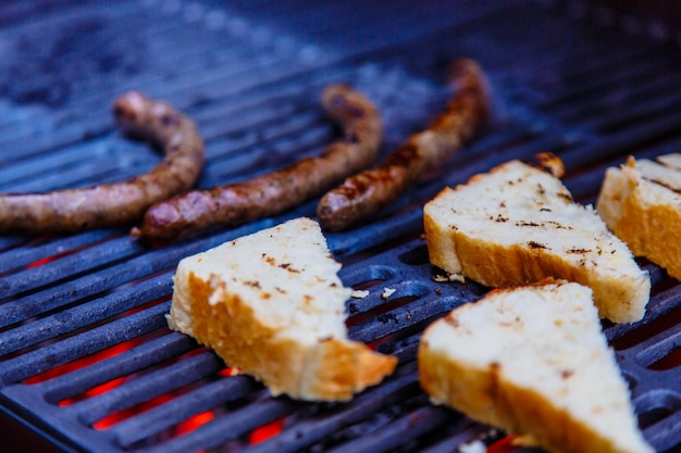 Sausages and bread fried on the grill that evening