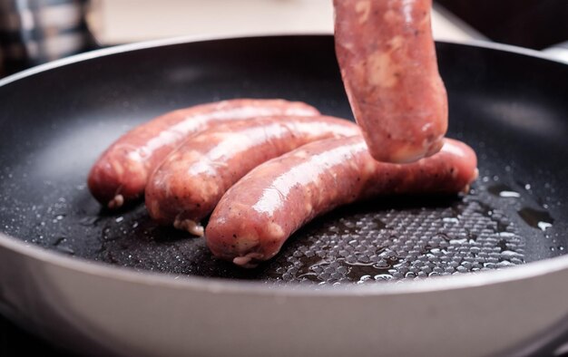 Sausages cooking