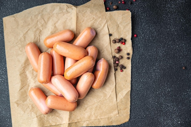 Sausages fresh meat pork beef chicken turkey healthy meal food snack on the table copy space