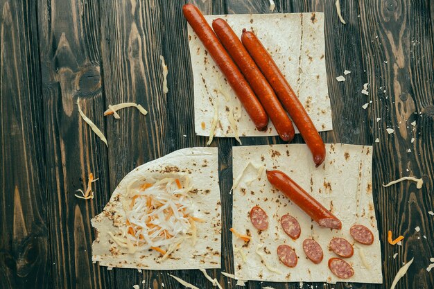 Sausages,pickled cabbage and pita bread for making burritos