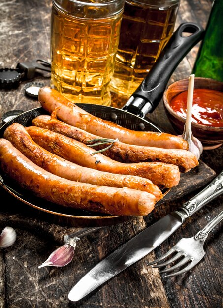 Sausages with cold beer and sauce