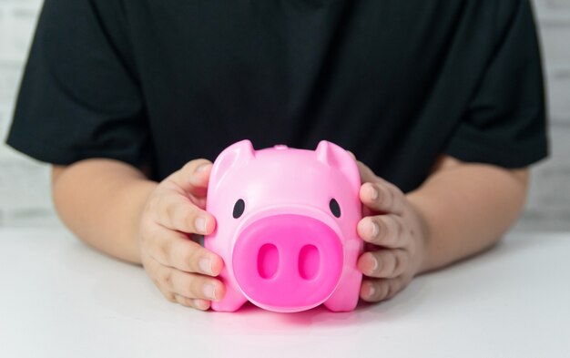 Save money business concept money piggy bank child and adults