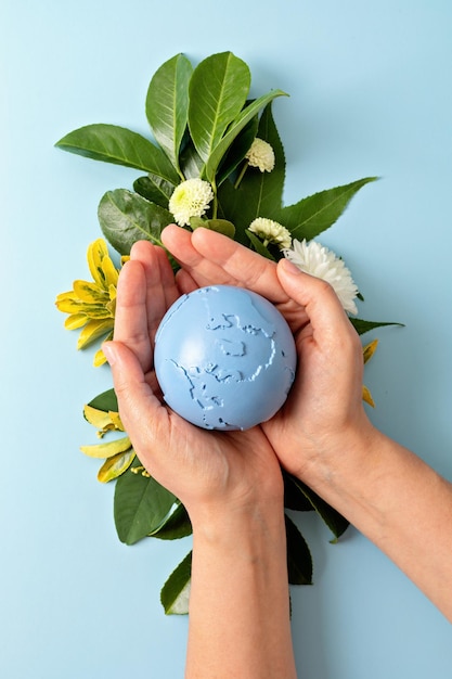 Save the planet idea Human hands holding globe earth International Earth Day