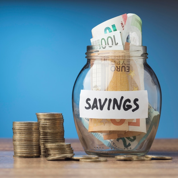 Photo saving in glass jar with banknotes