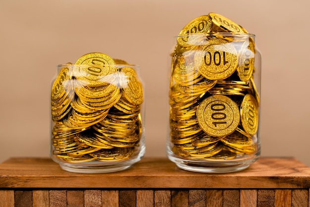 Saving gold Saving money Gold savings concept in a glass jar Store gold in a glass jar