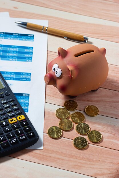 savings concept bills calculator coins and piggy bank