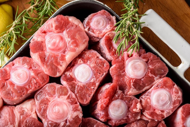 Savory delicacy closeup of raw oxtail pieces seasoned with sea salt and spices showcasing in 4k