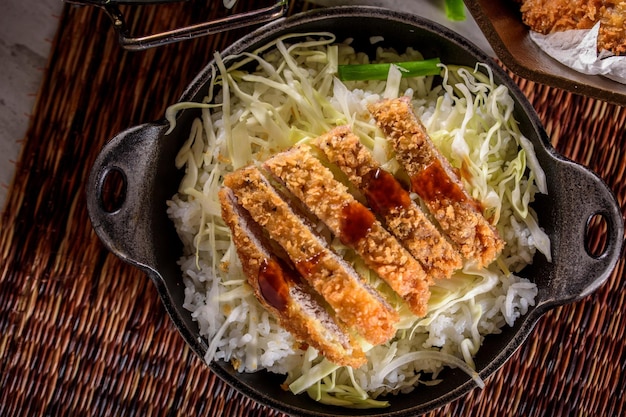 Savory Delights CloseUp of DeepFried Orange Chicken Served on a Bed of Steamed White Rice in 4k