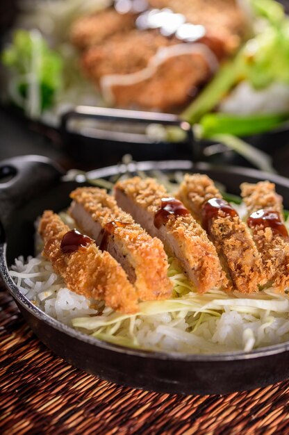 Savory Delights CloseUp of DeepFried Orange Chicken Served on a Bed of Steamed White Rice in 4k