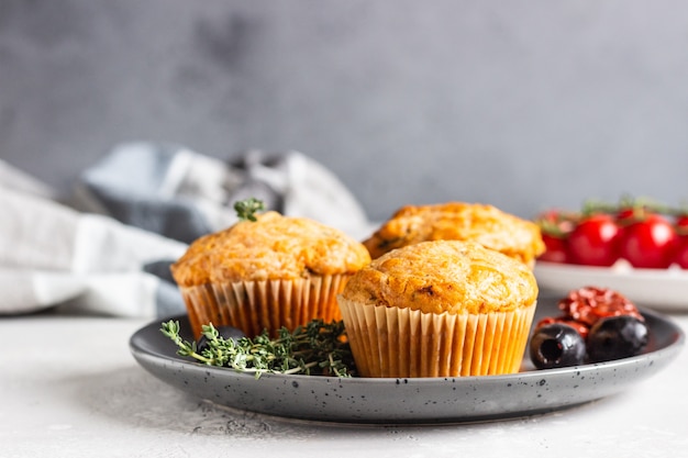 Savory muffins with dried tomatoes and olives