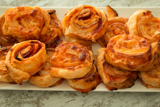 Savory puff pastries spiral shaped 