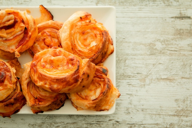 Savory puff pastries spiral shaped 