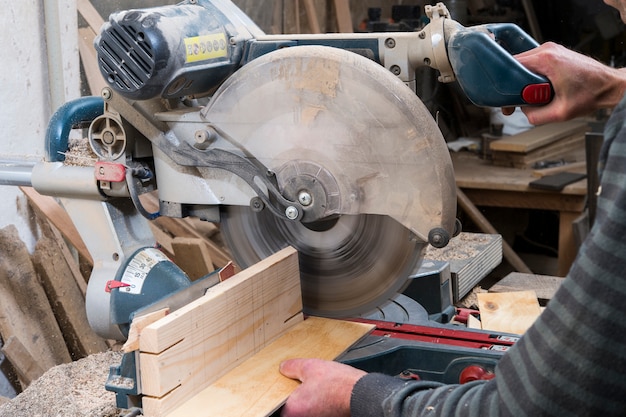 Sawing wood pieces circular saw