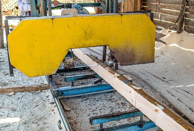 A sawmill for sawing wooden logs on boards