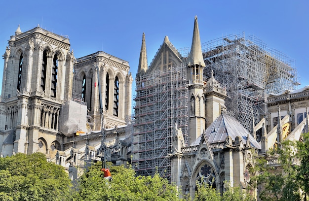 Scaffolding on the facade of the cathedral notre dame de Paris after fire