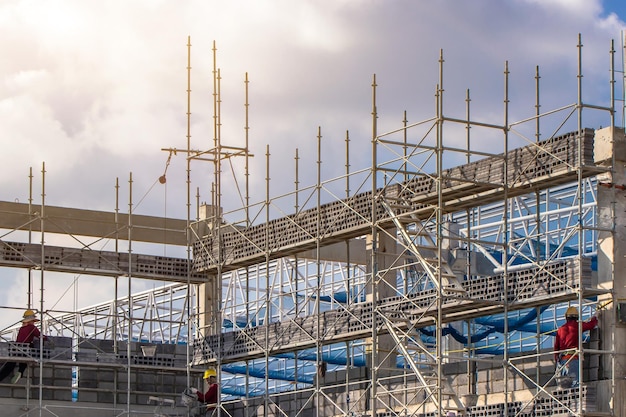 Scaffolding pipe clamp and partsconstruction site with scaffold and building strength to scaffold clamps in used on construction site with sunset backgroundscaffolding for construction factory