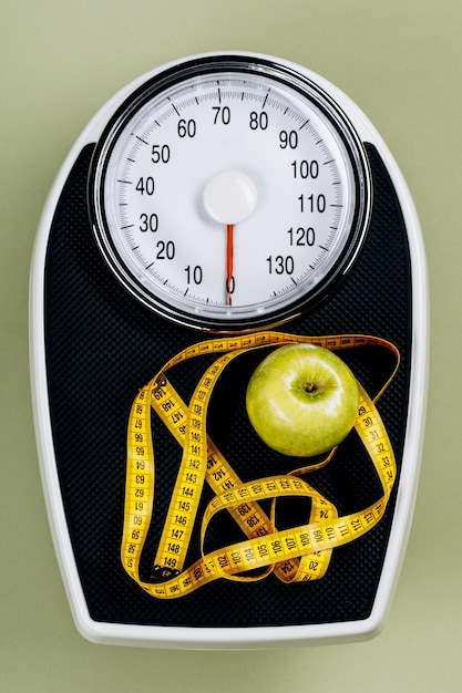 Photo scales and measuring tape top view the concept of excess weight