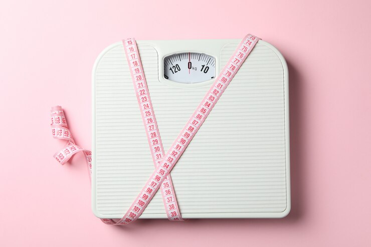 Photo scales and measuring tape. weight loss concept