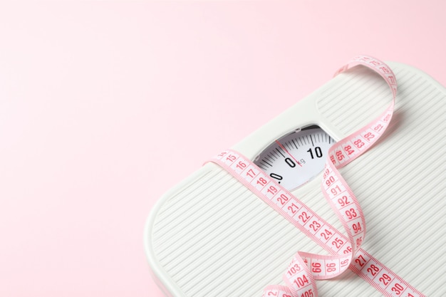 Photo scales and measuring tape. weight loss concept