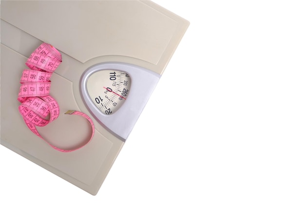 Scales with measuring tape, symbol and concept weight loss, sports and fitness.