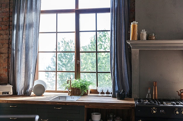 Scandinavian classic minimalistic dark gray kitchen with wooden details