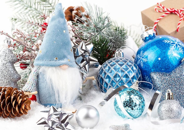 Scandinavian gnome and various Christmas toys on white background In the foreground are cones and Christmas decorations The concept of New Year and Christmas Can be used on postcards banners flyers