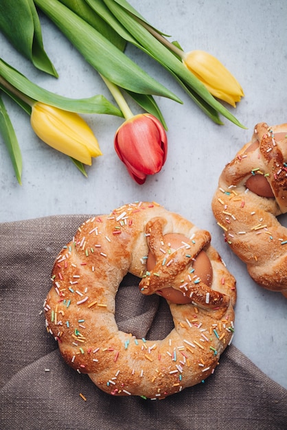 Scarcella, a traditional pastry for Easter holidays in Puglia region with colorful tulips