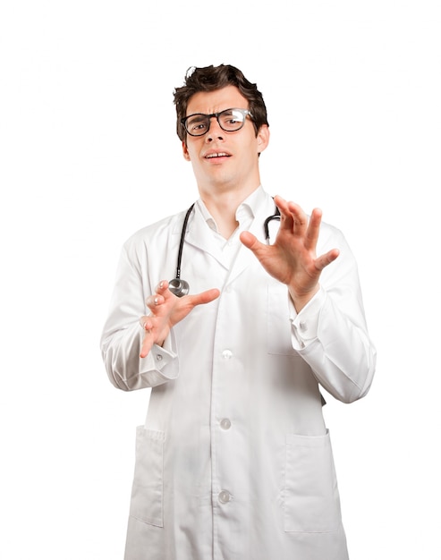 Scared doctor against white background