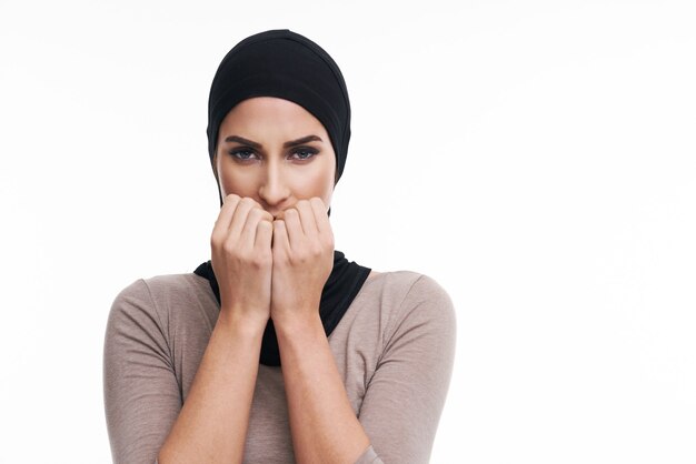 scared muslim woman over white background