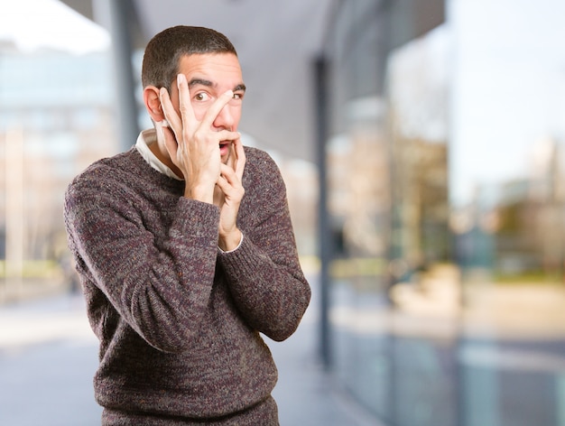 Scared young man posing